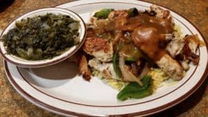 Chicken Tips over Rice with a side of Turnip Greens