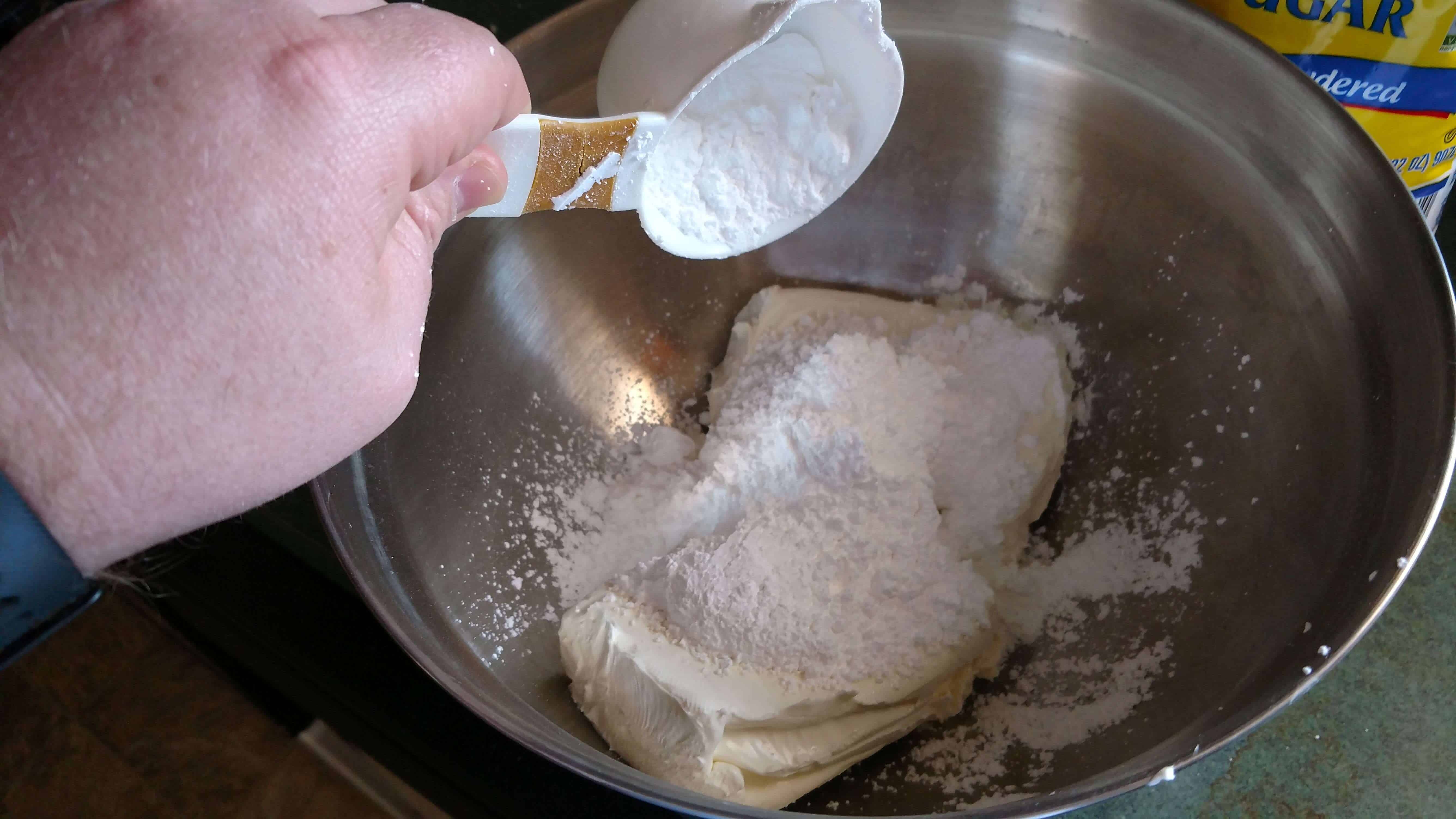Adding powdered sugar to cream cheese