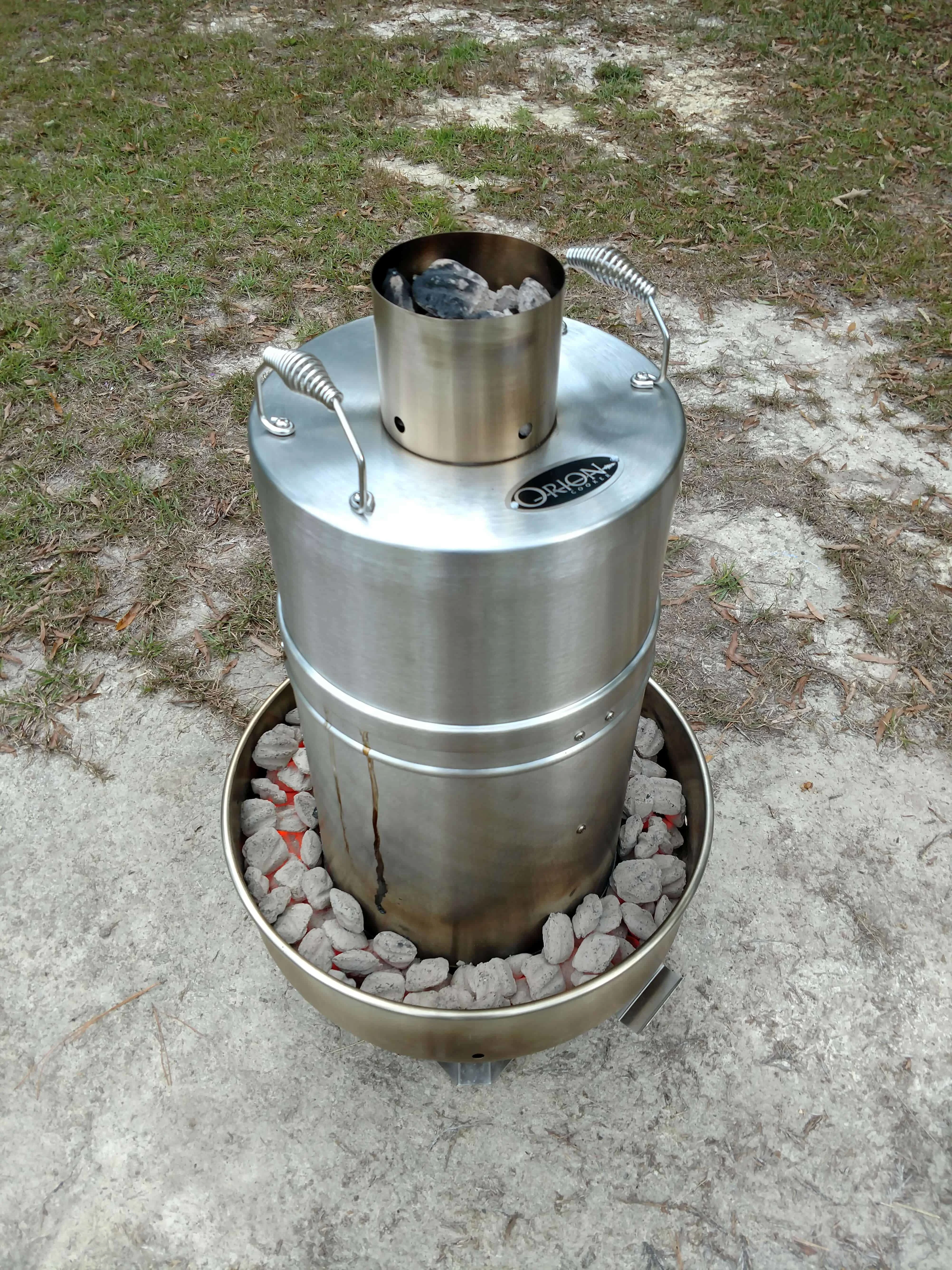 picture of the orion cooker with charcoal lit.