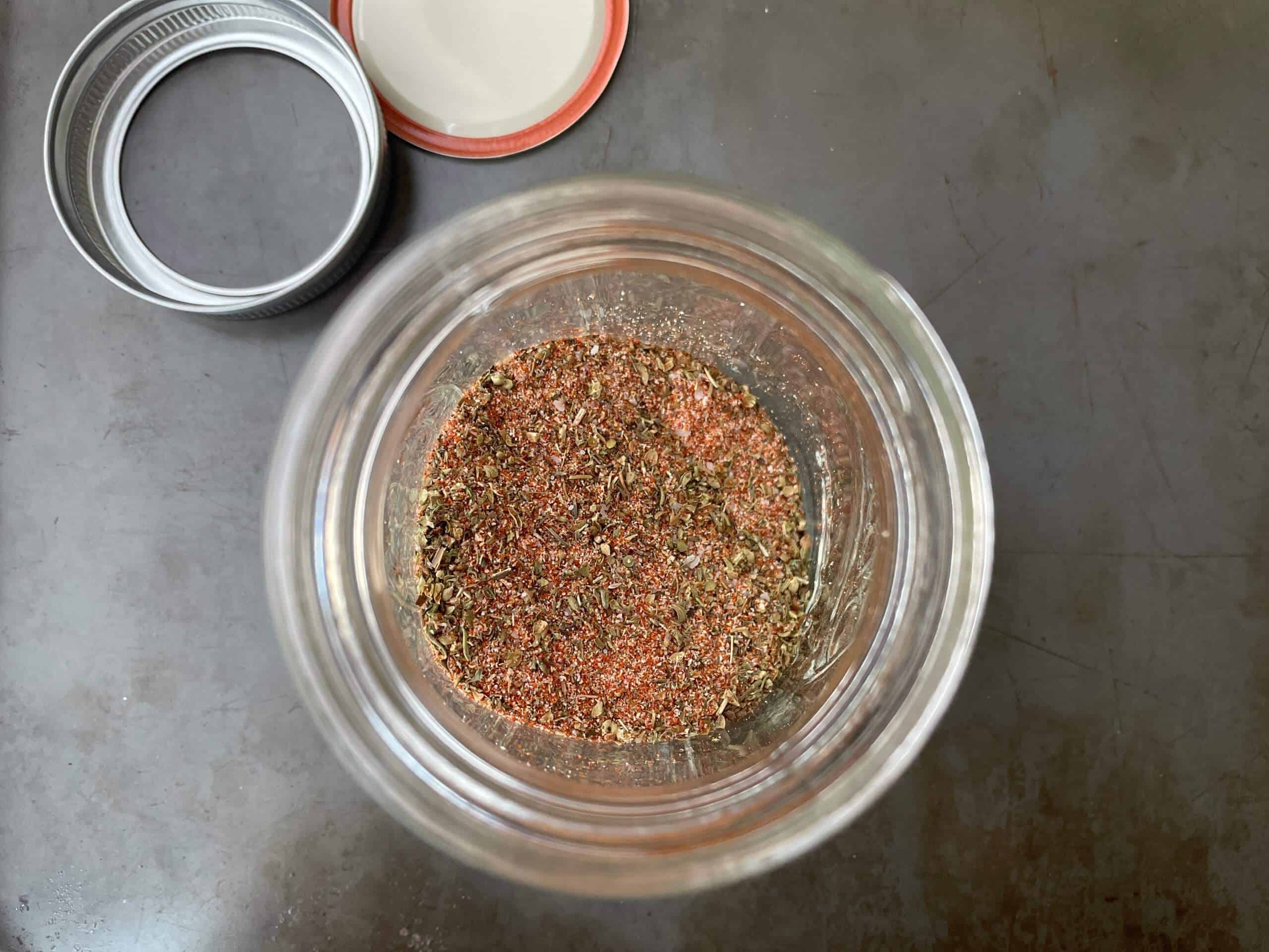 overview of cajun seasoning in a mason jar