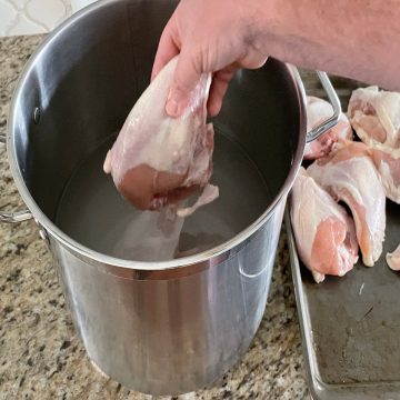 putting whole chicken breasts in a chicken brine recipe