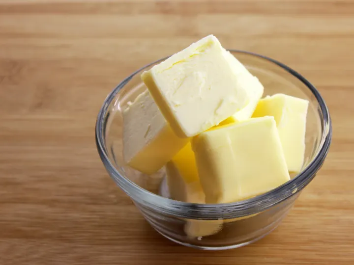 salted butter in a clear dish.