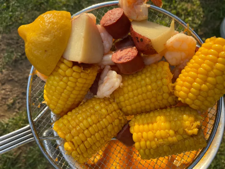 Closeup of the low country boil coming out of the pot.
