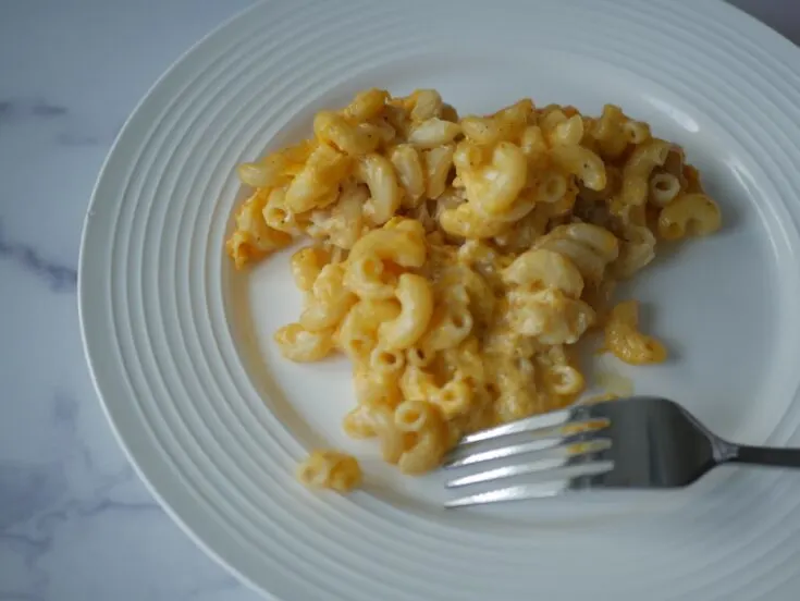 southern-style crock pot mac and cheese on a white plate.