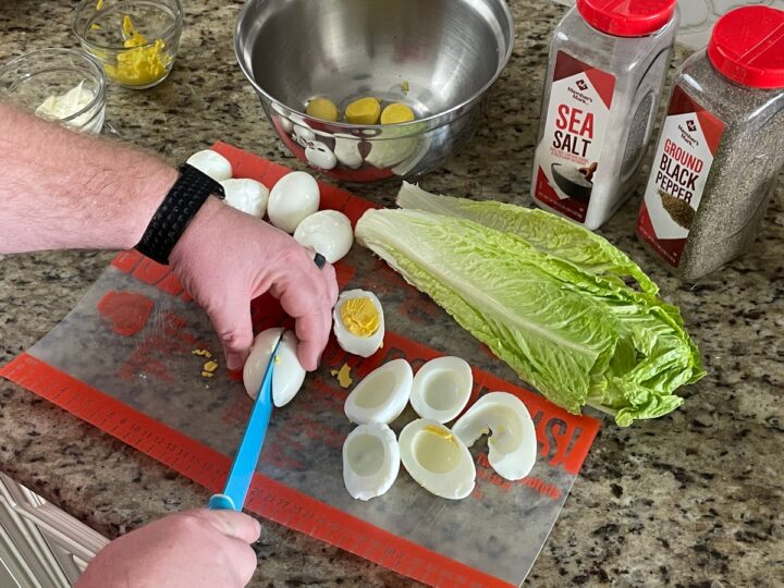 cutting eggs in half.