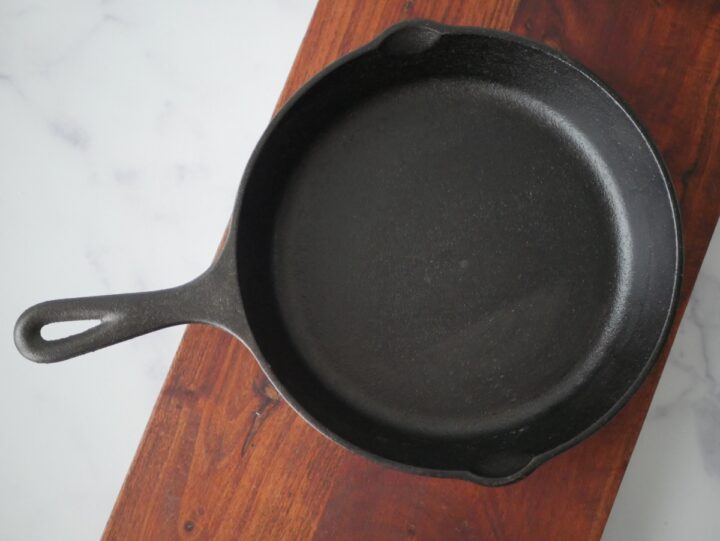 The rough texture of a lodge cast iron skillet.