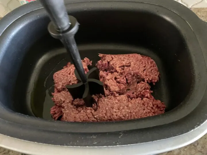 Use the mix and chop to chop up the ground meat.