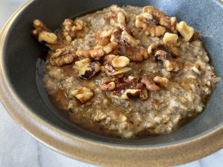 homemade oatmeal with chia seeds and walnuts closeup shot.