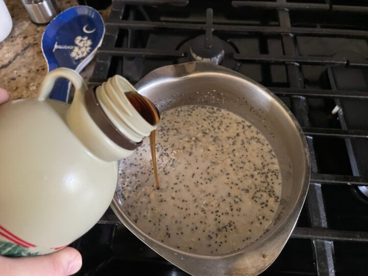 adding pure maple syrup to homemade oatmeal recipe.