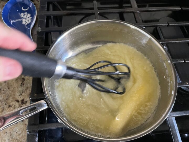 Mixing butter and sugar for yum yum cake topping.