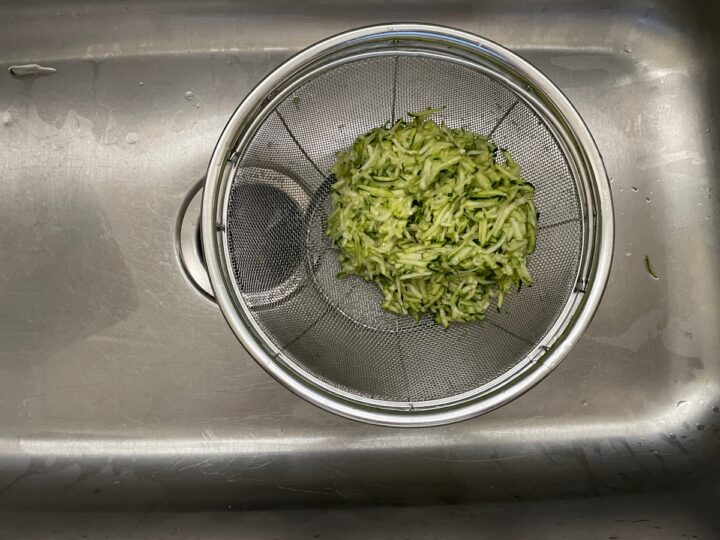Letting shredded Zucchini drain. 