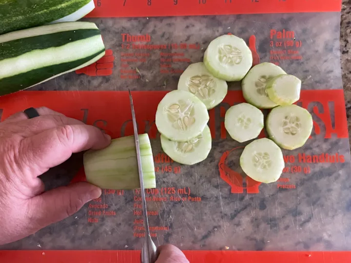 Slicing cucumbers.