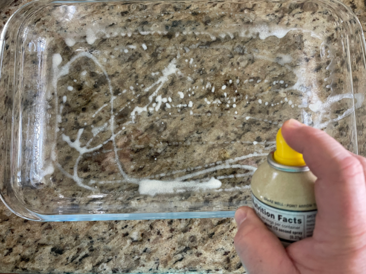 Spraying cooking spray in a 9x13 casserole dish to help prevent sticking of the recipe. 