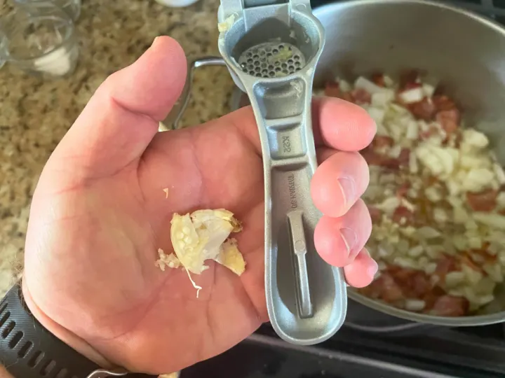 Once you squeeze or press out the garlic, you are left with the peel.