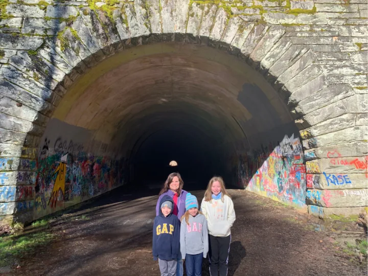 Our family standing in front of the tunnel on the road to nowhere in Bryson City, NC.