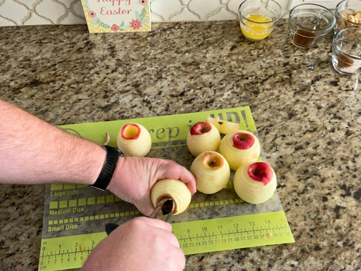 This image shows step one of coring an apple.