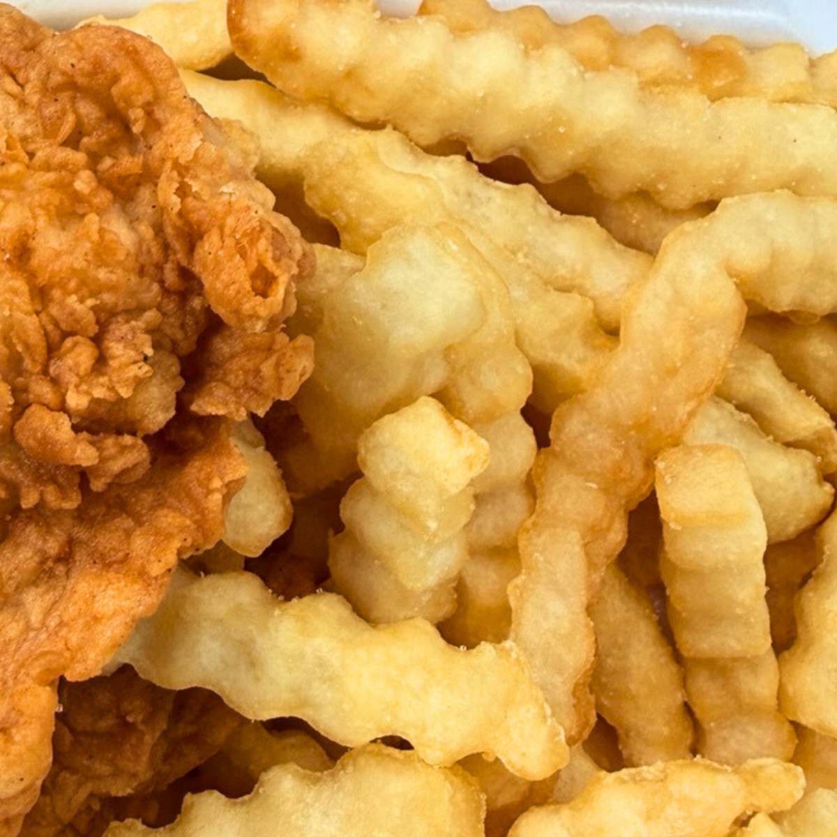 Golden crinkle-cut fries served at Raising Cane’s Rock Hill location