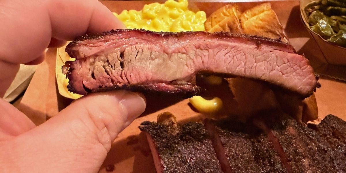 Close-up of a dry-rubbed rib showing the smoke ring at Haywood Smokehouse in Waynesville