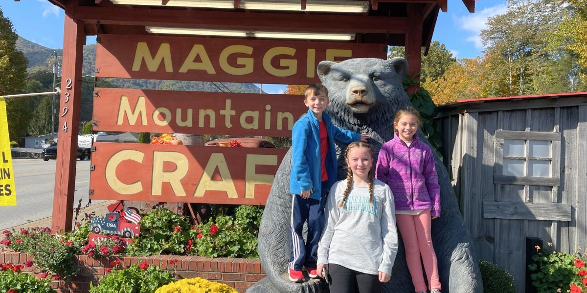 Kids standing in front of Maggie Valley Mountain Crafts on Soco Road in Maggie Valley, NC