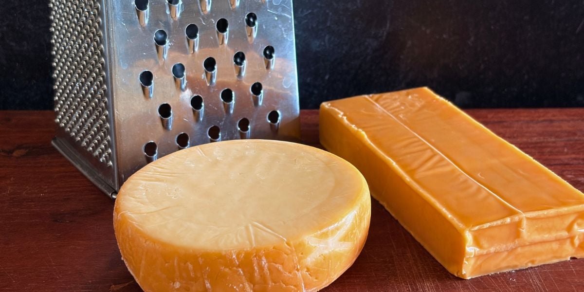 Blocks of smoked Gouda and sharp cheddar ready to be grated.